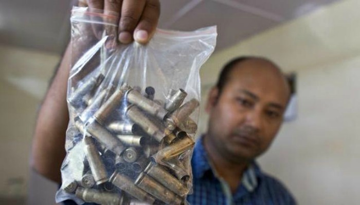 A forest official shows shell casings recovered from the site of a rhino killed by AK 47 at KNP
